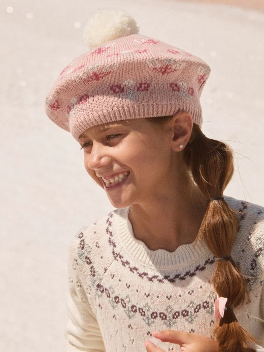 Розова зимна шапка с помпон и цветни мотиви за момиче