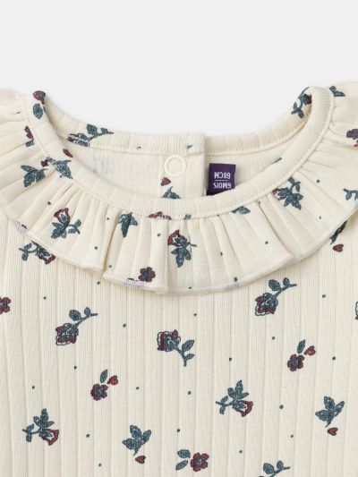 Екрю боди с флорален принт за бебе момиче